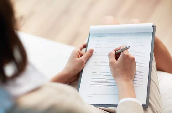 Insurance Claims 3 insurance agent filling out form