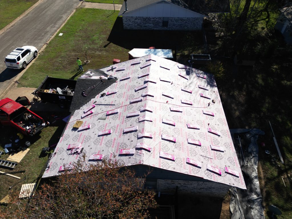 Roofing crew working on a roof in Franklin County, Texas
