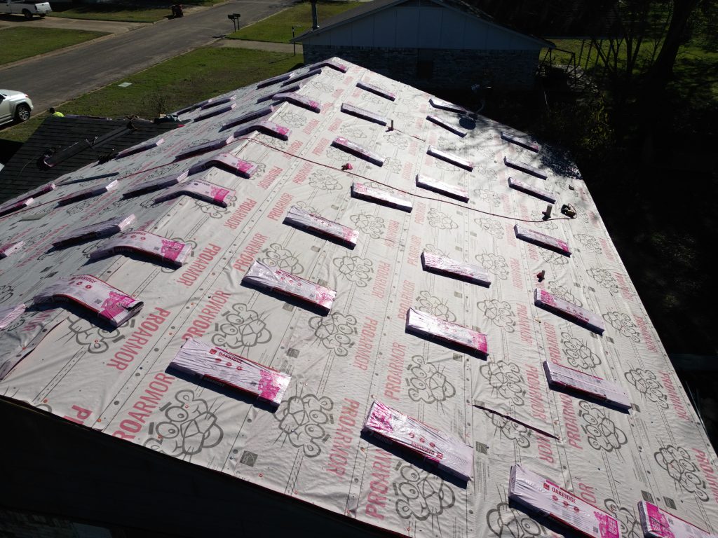 Roofing Contractor in Rockwall, TX 3 Roofing crew working on a roof in Northeast Texas