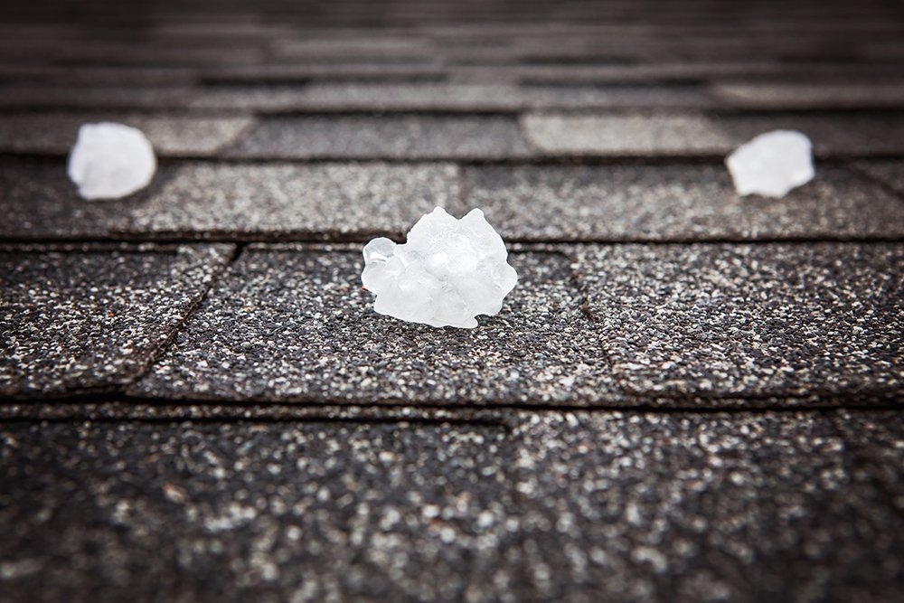 Hail storm damage in Northeast Texas — asphalt shingle roof after April 2026 storms