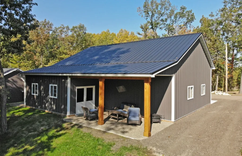 Barndominium with a dark standing seam roof near Sulphur Springs