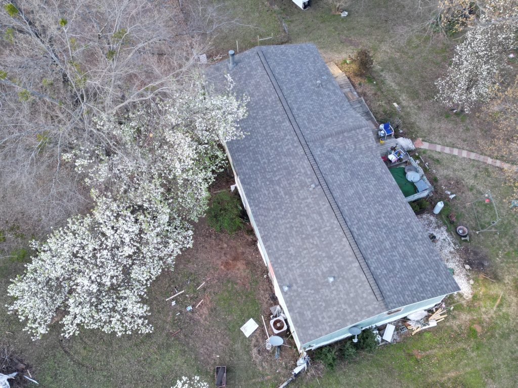 Ridge and shingle courses on a completed roof near Como, Texas