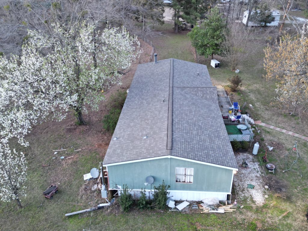 Completed shingle roof on a home near Como, Texas, seen from the gable end