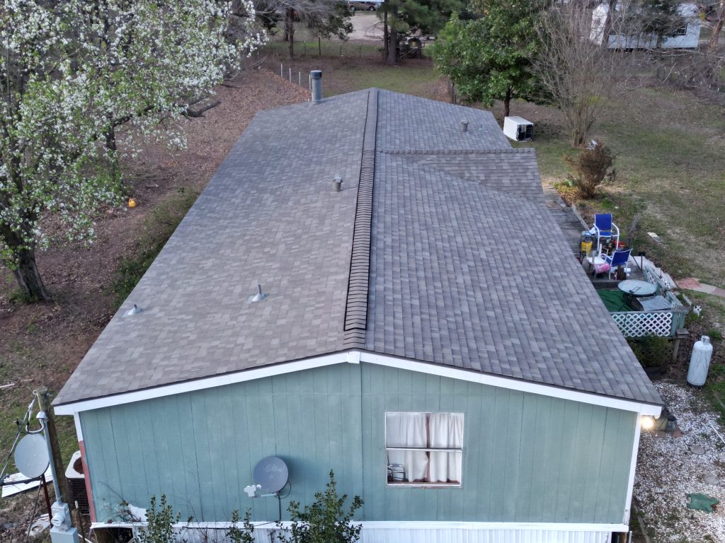 Roofing Contractor in Arbala, TX 1 Hip and eave of a completed shingle roof near Como, Texas
