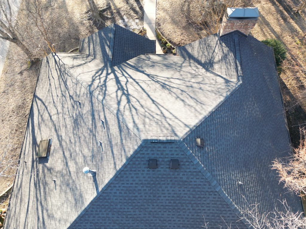 Ridge and hips of a finished shingle roof in Greenville, Texas